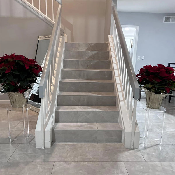 Two-tier storage design of clear acrylic table showing spacious shelving for books and decor items
