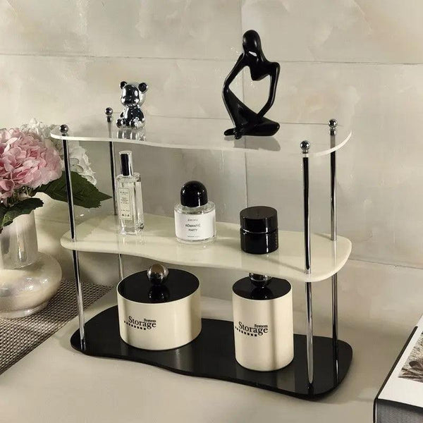 Front view of 3 tier acrylic perfume display shelf on vanity
