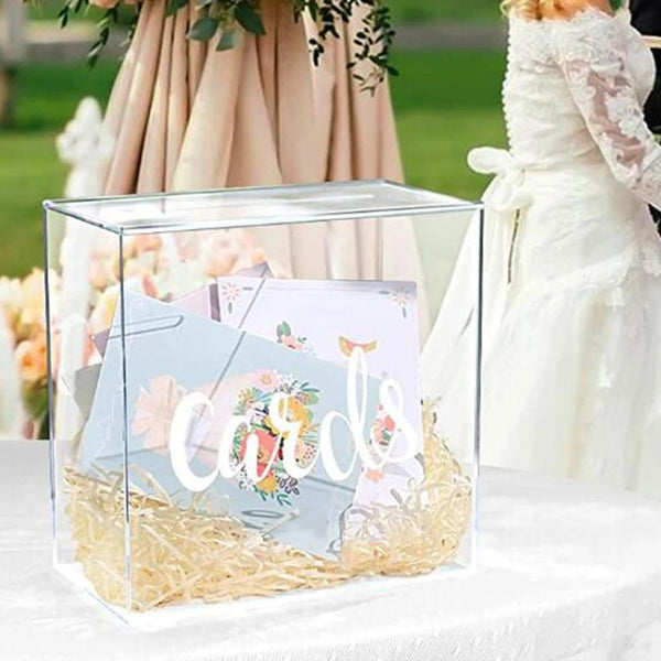 Acrylic card box displayed on a wedding reception table