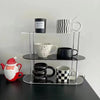 Top view of acrylic desk organizer displaying three-tier configuration and storage compartments