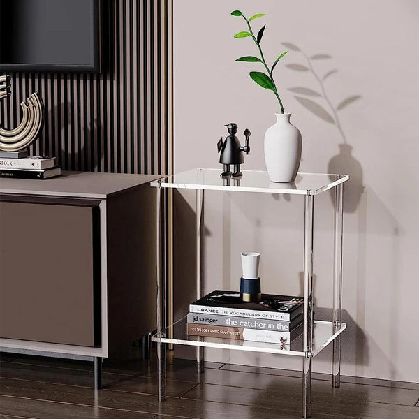 Compact clear acrylic side table fitting in a small apartment corner for storage and display