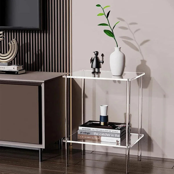Compact clear acrylic side table fitting in a small apartment corner for storage and display
