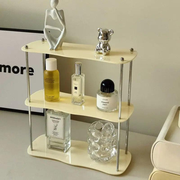 Clear acrylic shelf holding skincare and nail polish