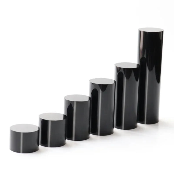 45 degree angle view of black acrylic display stand highlighting cylindrical shape
