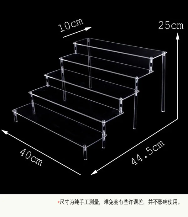 Essential oil bottles organized on clear acrylic step display