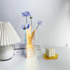 Modern acrylic vase variant F in contemporary home interior setting