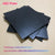 Smooth surface black ABS plastic board texture close-up
