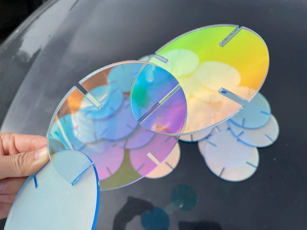 Professional retail signage using translucent acrylic discs for eye catching store displays