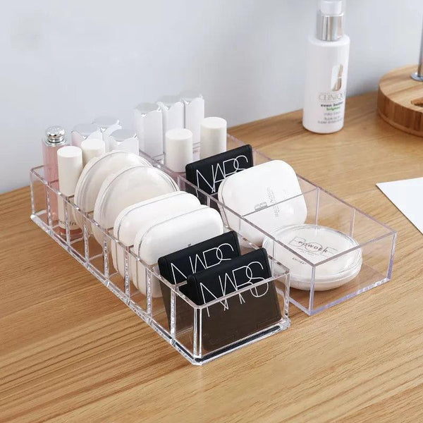 Clear acrylic cosmetic organizer on vanity table with skincare products