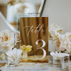 Close-up of laser cut acrylic table number showing gold UV printed lettering and polished edge finish