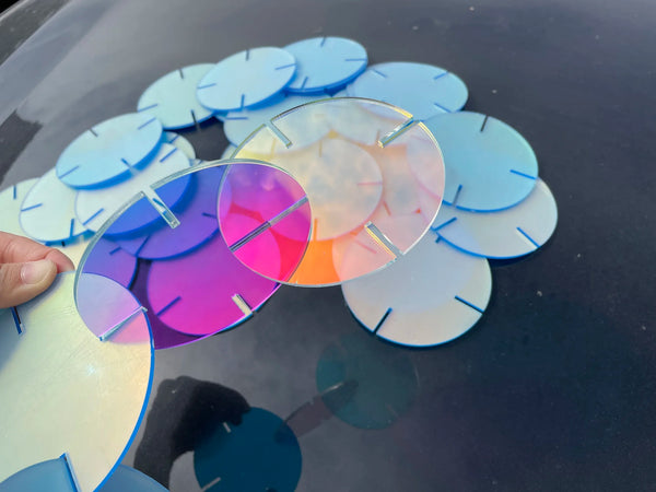 Modern home decor featuring color shifting acrylic discs as illuminated wall art installation