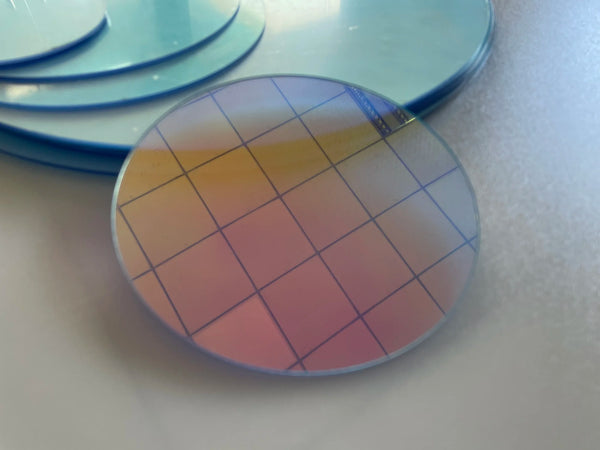 Contemporary art gallery installation using dichroic acrylic circles with natural light