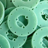 Close-up detail of green FR4 epoxy glass fiber sheet surface texture for PCB applications