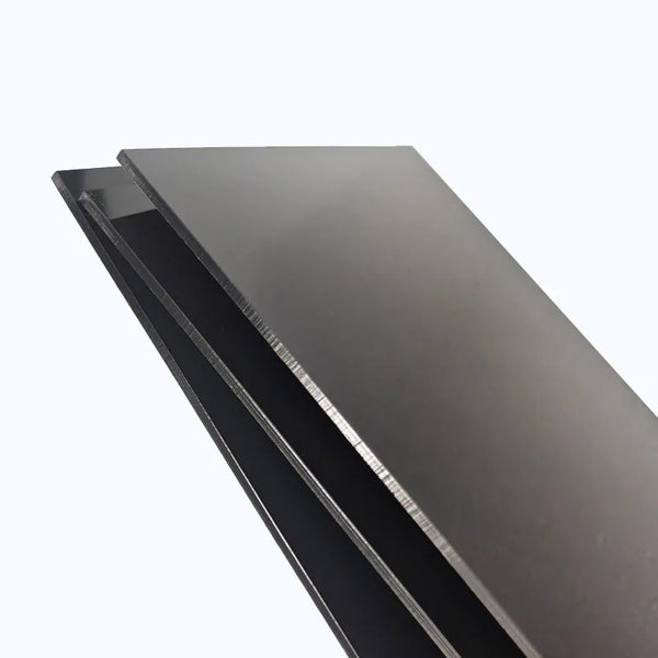 Close-up of glossy black acrylic sheet surface showing superior cast PMMA quality