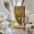 Multiple gold acrylic table numbers arranged showing consistent quality and elegant design