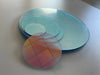 Cross-section detail showing iridescent PET film coating on clear PMMA acrylic base