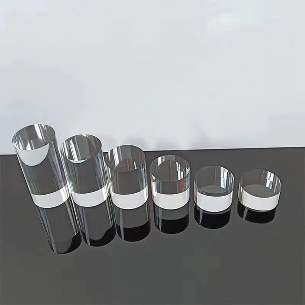 Diamond ring displayed on clear acrylic cylinder photography prop