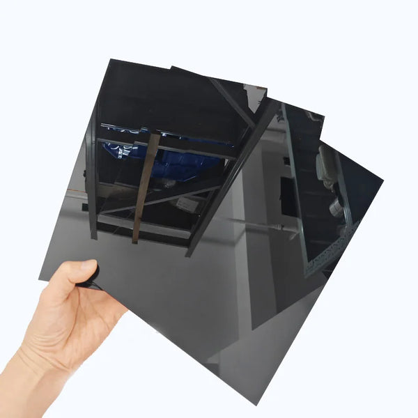 Laser cutting black cast acrylic sheet showing smooth polished edges and precision
