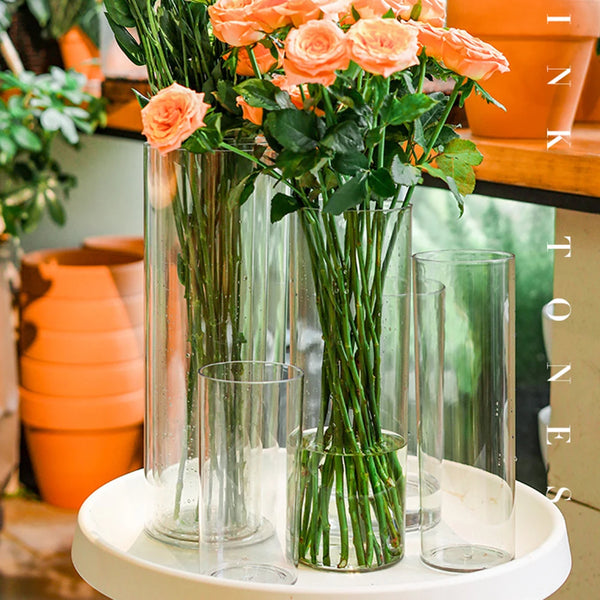 Lightweight acrylic cylinder vase being held demonstrating easy portability