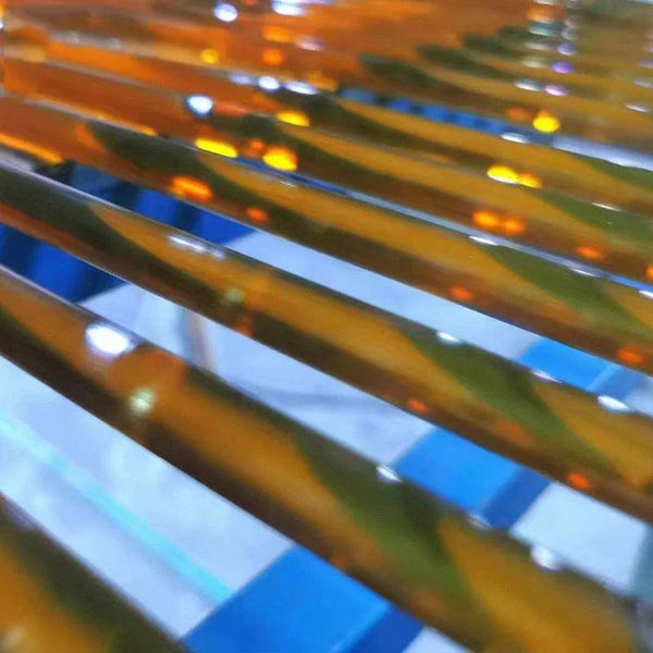 Machinable Ultem PEI rod being CNC cut to custom length