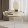 Acrylic side table next to sofa, perfect for drinks and decor