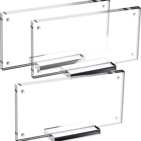 Multiple acrylic currency frames arranged on desk showing collection display setup