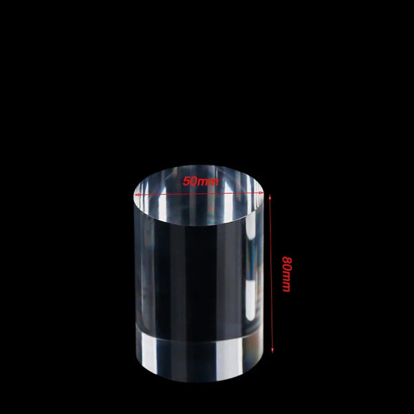 Nail polish bottles displayed on small acrylic cylinder risers