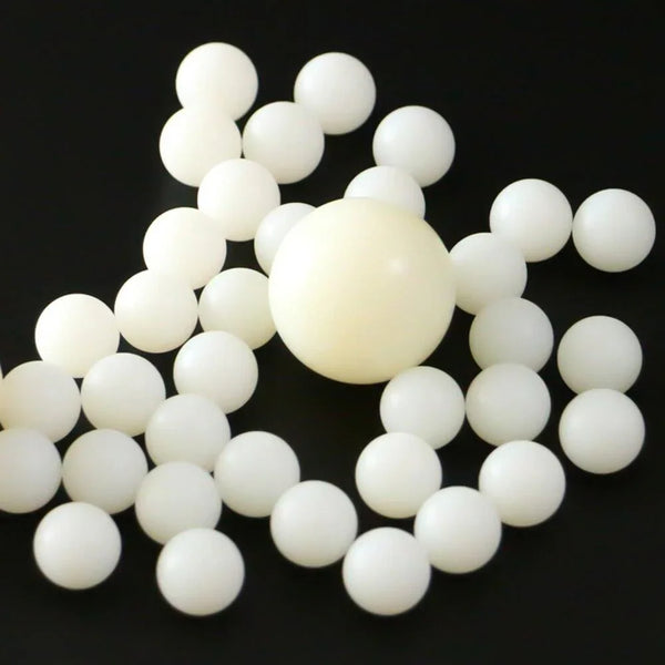 Close-up of white nylon PA66 ball showing smooth surface finish