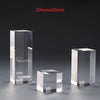 Designer perfume bottle elevated on clear acrylic display stand