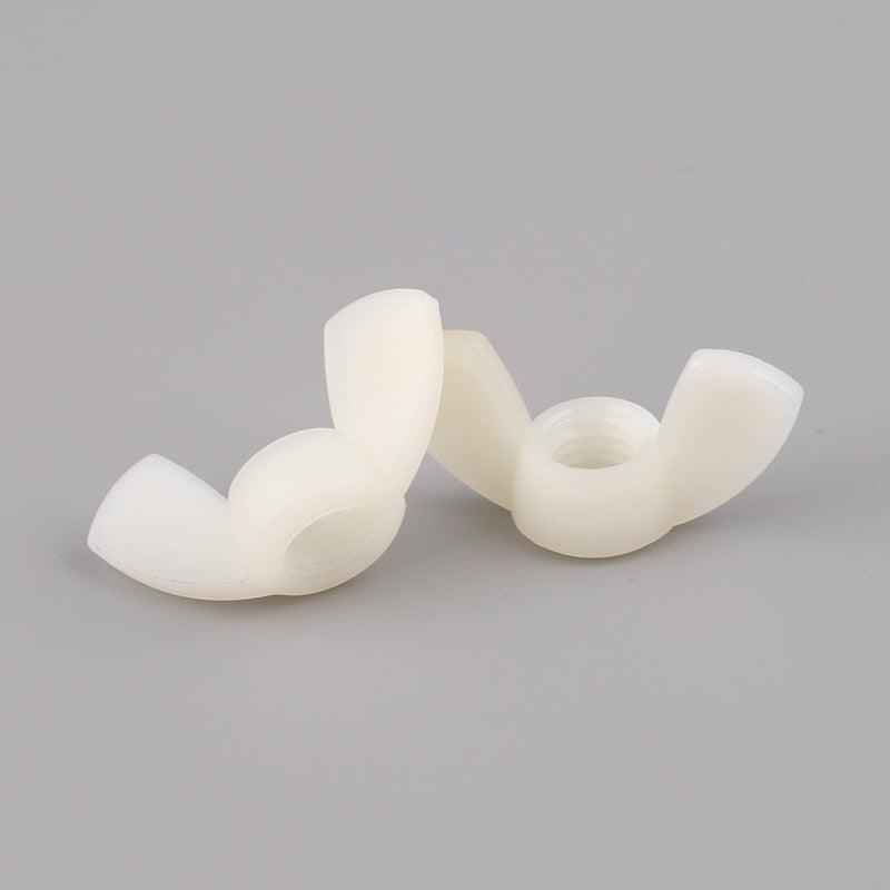 Insulated plastic wing nuts for use in electronics housing and component enclosures