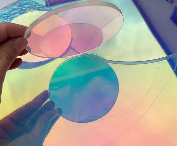 Size comparison of 100mm, 200mm, and 300mm iridescent acrylic circles side by side