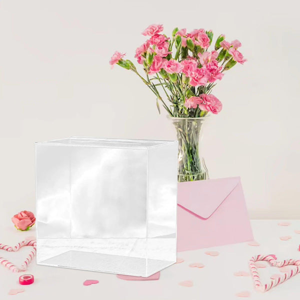 Rose gold acrylic card holder box on a wedding gift table