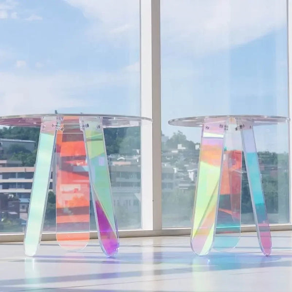 Round acrylic coffee table showing purple iridescent reflection top view