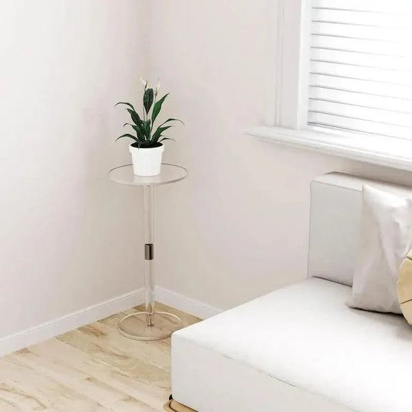 Compact acrylic side table next to sofa and bed, perfect for bedrooms and apartments