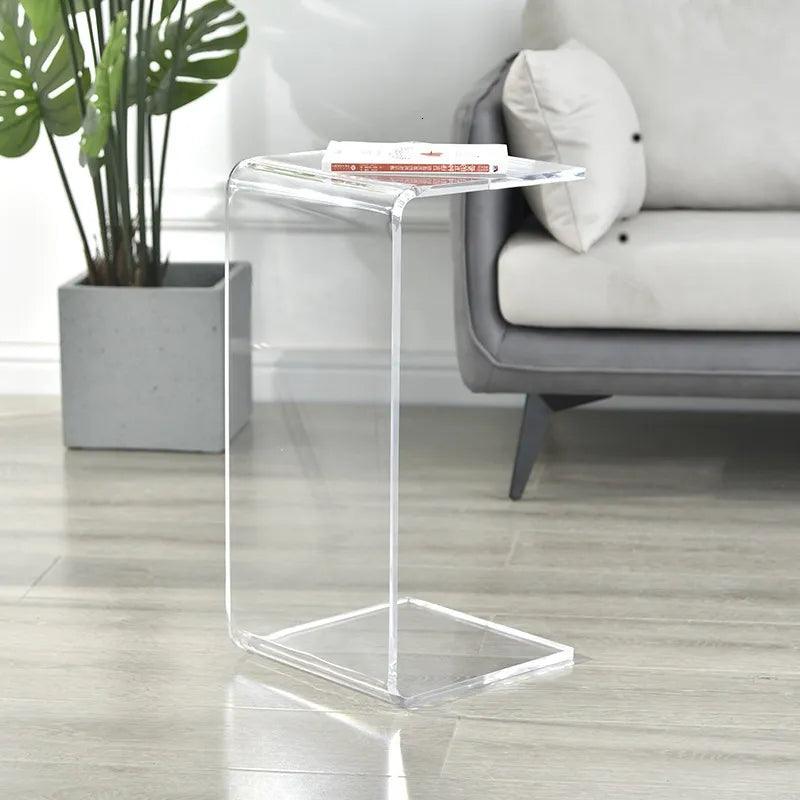 Clear acrylic side table used in compact living space