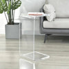 Clear acrylic side table used in compact living space