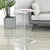 Clear acrylic side table used in compact living space