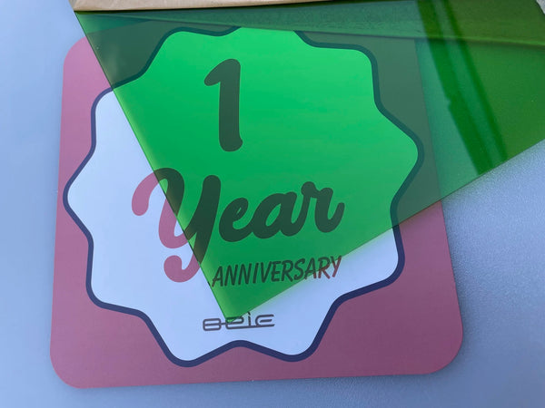 Store window display with colored translucent acrylic signage