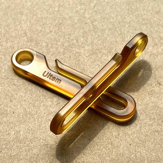 Close-up view of Ultem PEI EDC keychain with amber finish