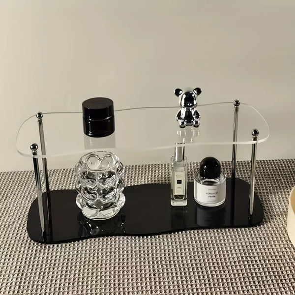 Front view of 2-tier clear acrylic display riser for perfume and cologne organization.