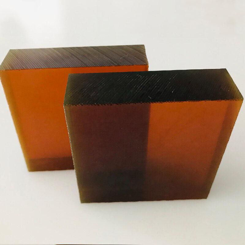 Ruler measuring thickness of ULTEM plastic sheet