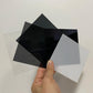 Translucent Black Acrylic Disc Close-up - Durable Plastic for Various Uses