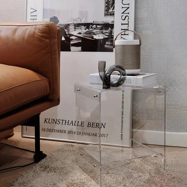 Clear acrylic coffee table in modern minimalist living room