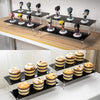 Top view of 4-tier black acrylic shelf for cupcakes and bottles