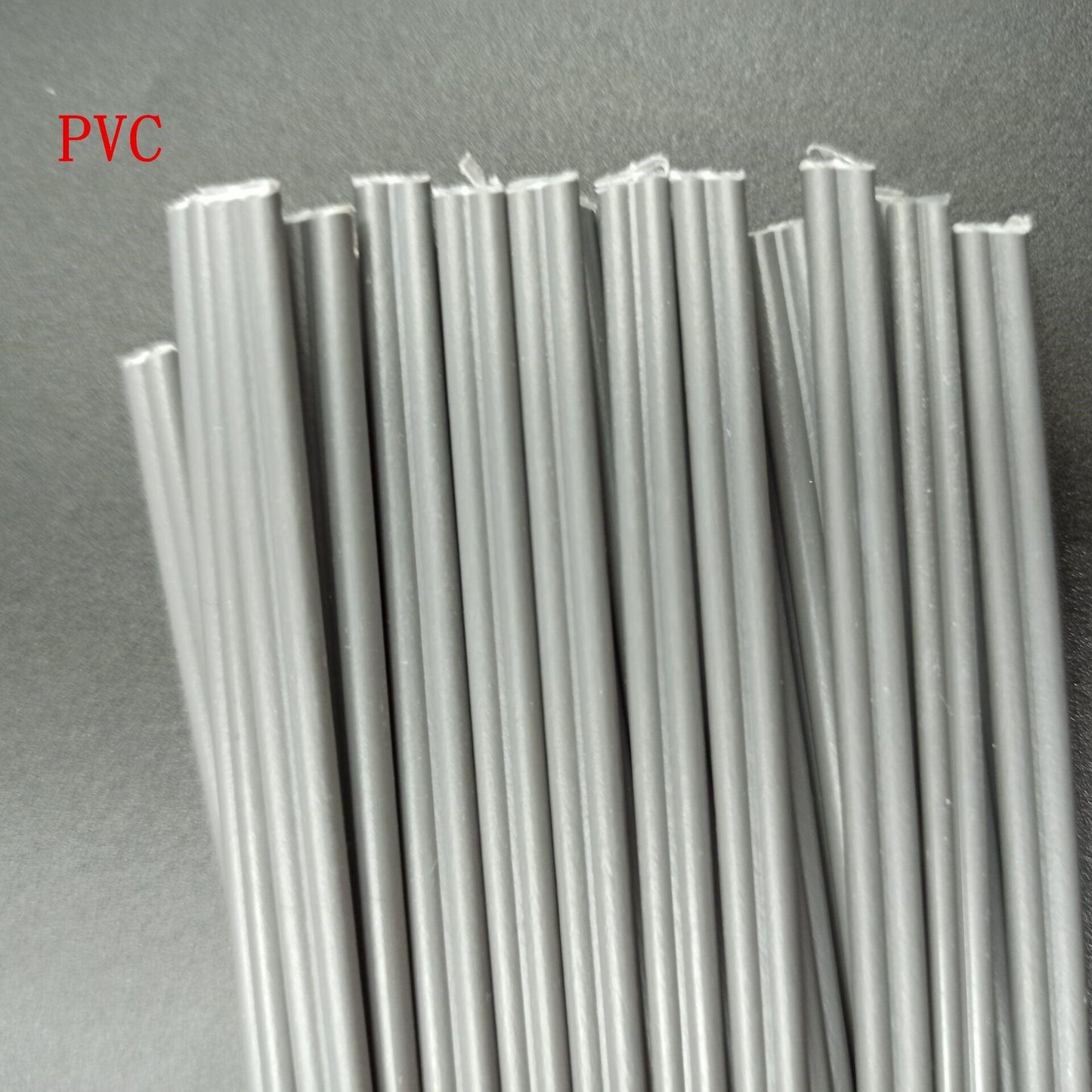 Plastic welding rods being used for car bumper repair with a heat gun