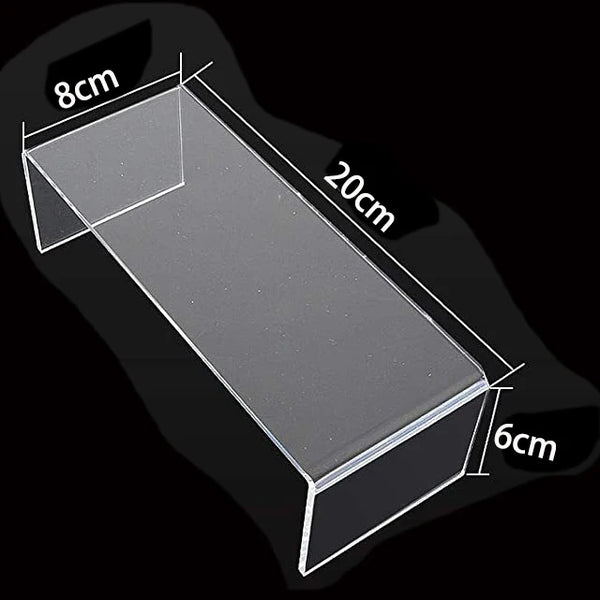 Unboxing acrylic display stand showing all parts and assembly instructions