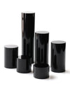 Diamond rings displayed on black acrylic cylinder stands for jewelry retail showcase