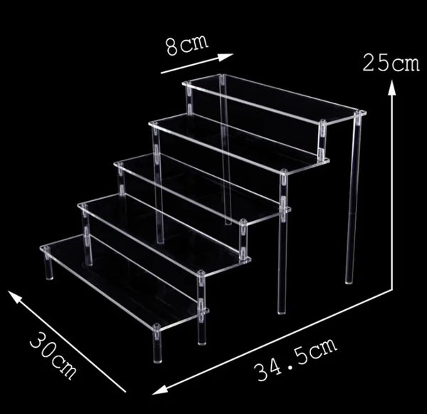 Gaming collectible figures arranged on acrylic tiered display stand