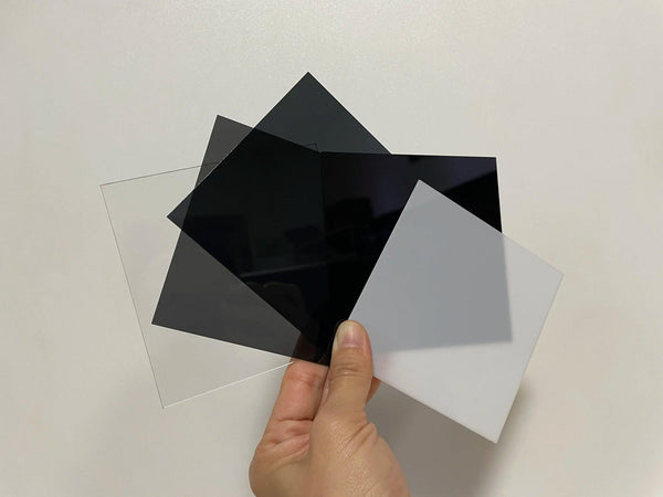 Laser-cut translucent black acrylic plastic board with smooth edges