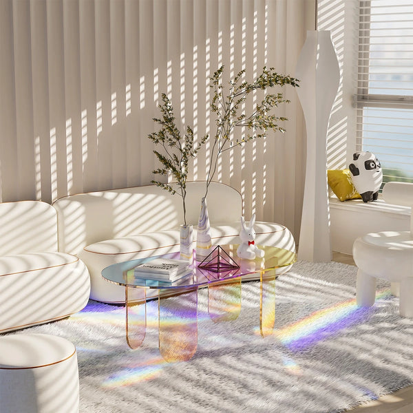 Modern clear acrylic coffee table with rainbow effect in contemporary small apartment living room